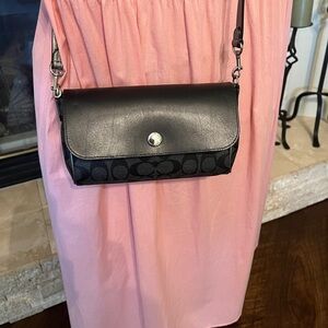Coach black and silver reversible clutch crossbody
